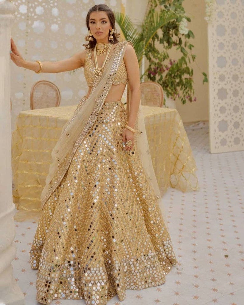 Buy Gold Mirror Work Net Lehenga Choli online At Zeel Clothing