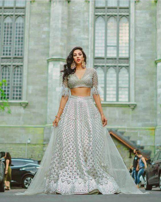 Silver lehenga with mirrorwork blouse and feather dupatta – Ricco India